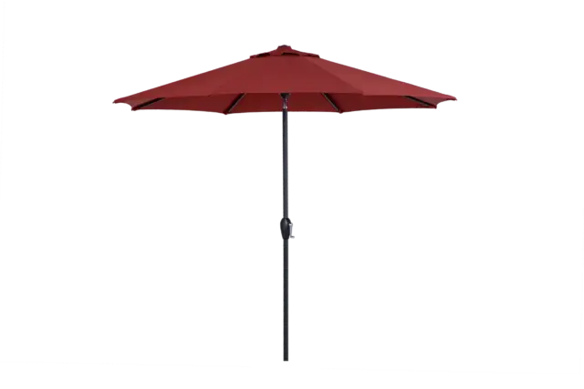 A full view of the California center pole patio umbrella with its red octagonal canopy fully open, showing the black pole and crank mechanism.