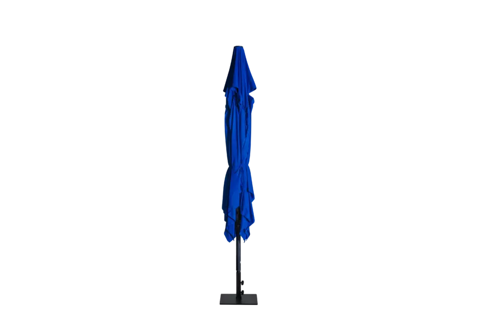 The royal blue Luciano commercial umbrella shown in its fully closed and collapsed position, highlighting its slim profile for easy storage.