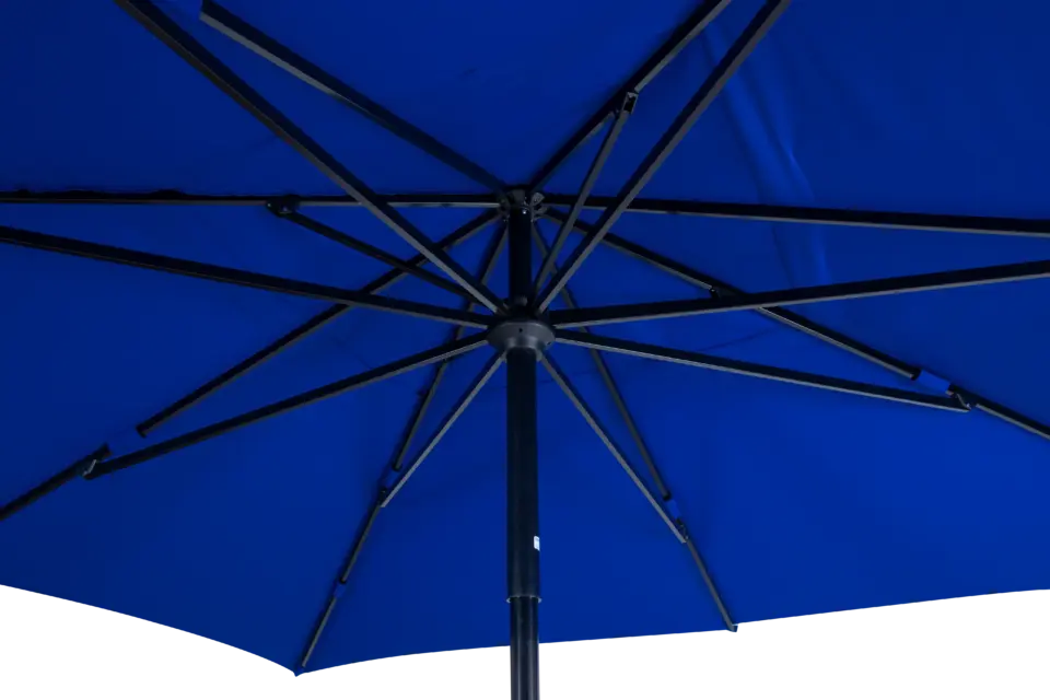 A detailed close-up looking up into the durable hub and heavy-duty rib assembly of the open blue Luciano outdoor umbrella, showing its strong construction.