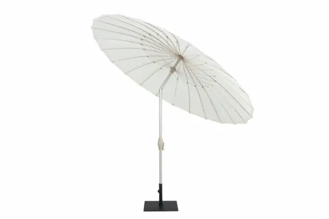 The full Oriental Charm pagoda patio umbrella with its off-white canopy tilted to the side. It features a silver central pole, a crank mechanism, and a heavy-duty black square base, shown against a white background.