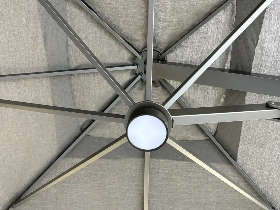 A detailed view from directly underneath the V1X umbrella canopy, revealing the full array of ribs and the central hub mechanism.