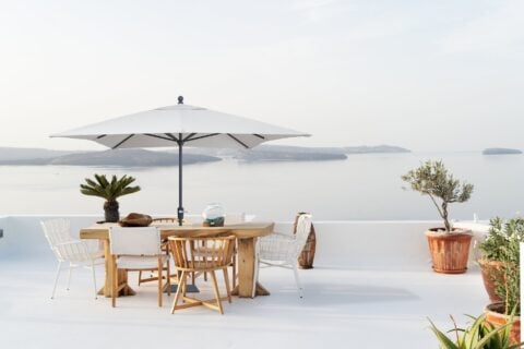 Tempo Easy Life III outdoor umbrella in a scenic outdoor setting.