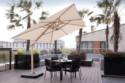 Tempo Milano cantilever umbrella in an outdoor patio setting.