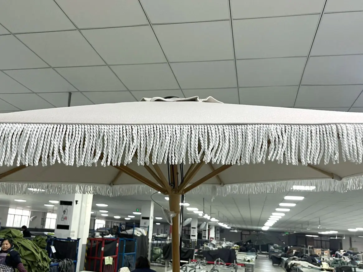 Sunbrella double-layer decorative edge, refined through laser cutting for production repeatability.