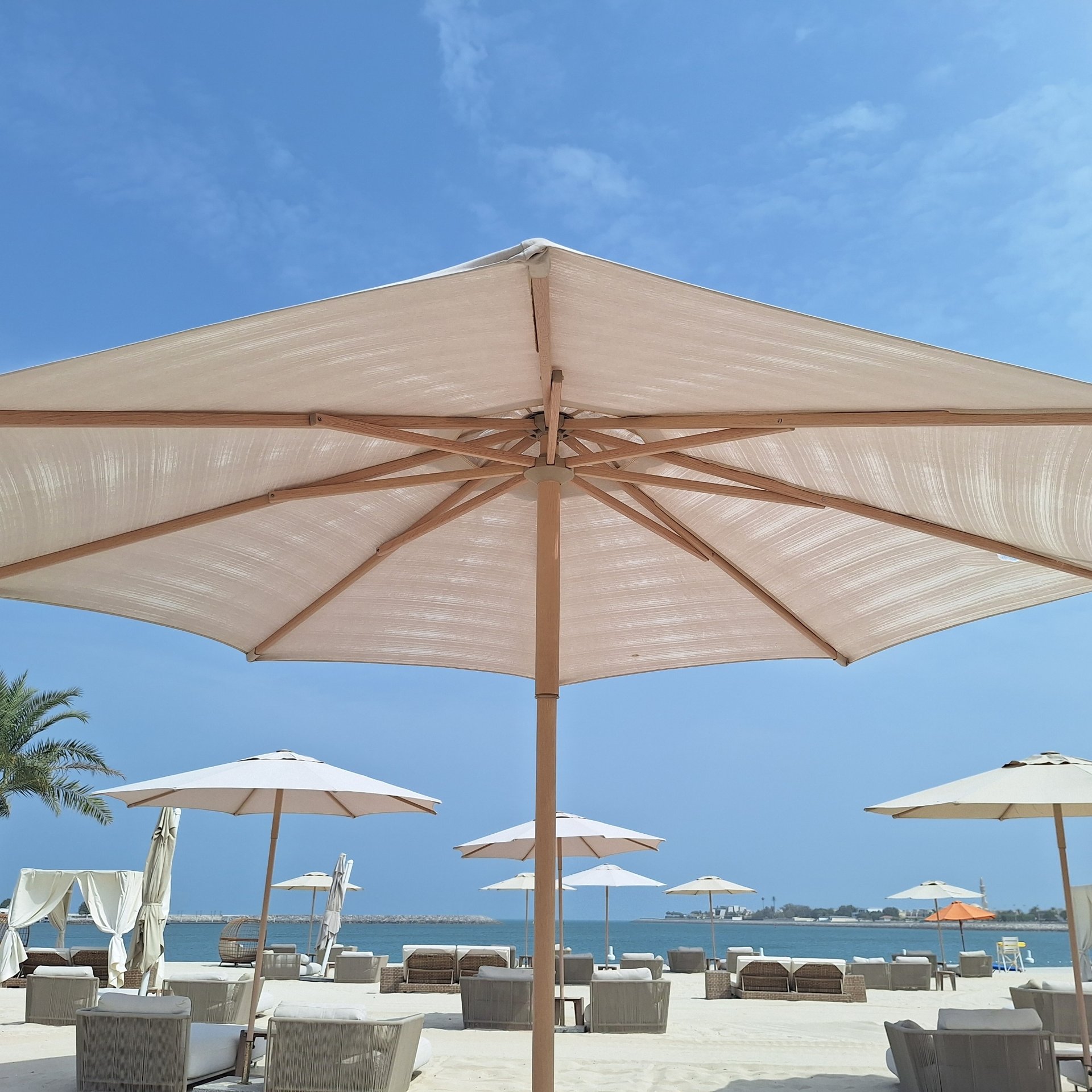 Commercial umbrellas deployed at a premium hotel setting in Dubai