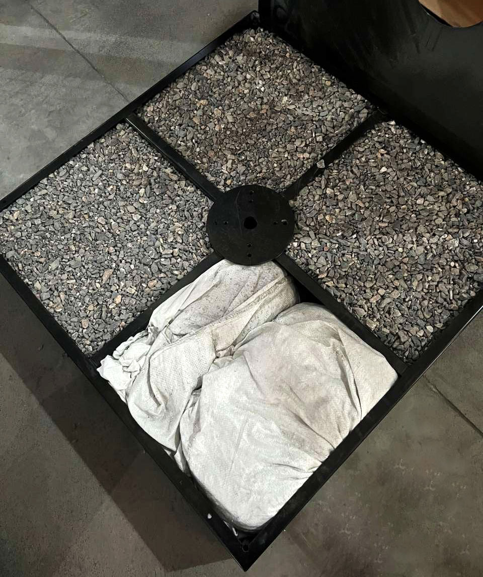 Bagged stone aggregate for on-site filling of the iron-box base.