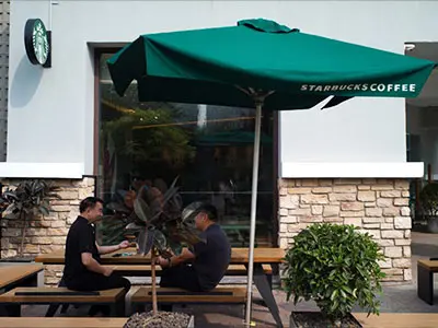 Before — Sagging canopy, tilted frame, inconsistent brand image